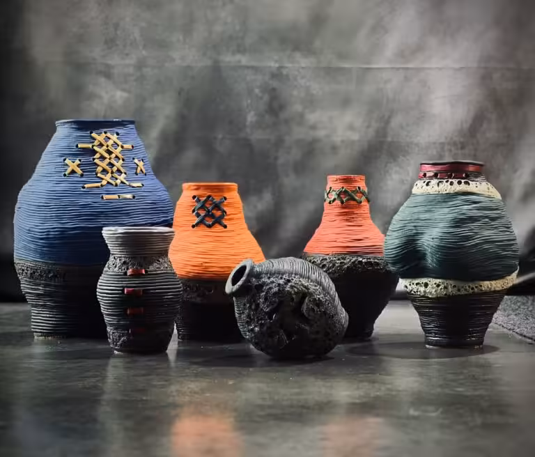 Reiner Kuske Ceramics Ngā Wahine handbuilt textured ceramic vessels in blue, orange and green display Nelson NZ